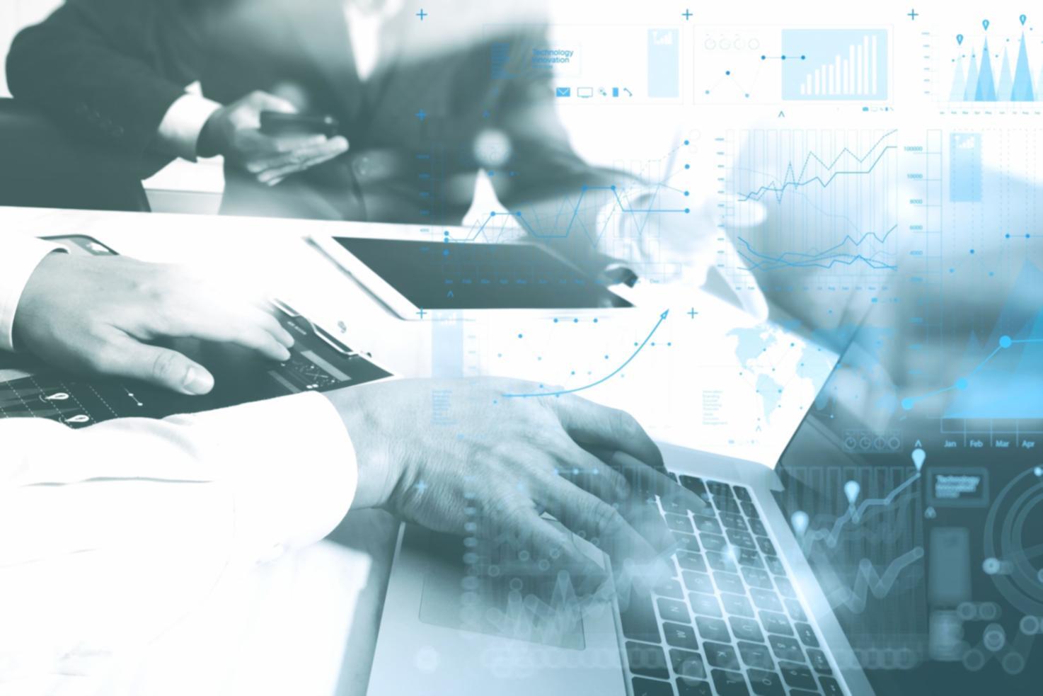 Workshop materials and technical documentation spread across desk workspace